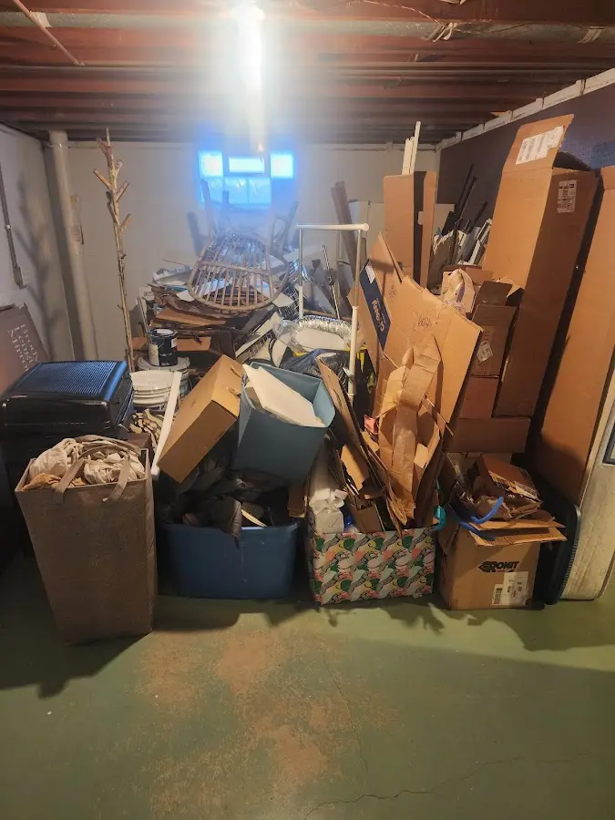 Roll-off dumpster container at job site for Construction Dumpster Rental in West University Place